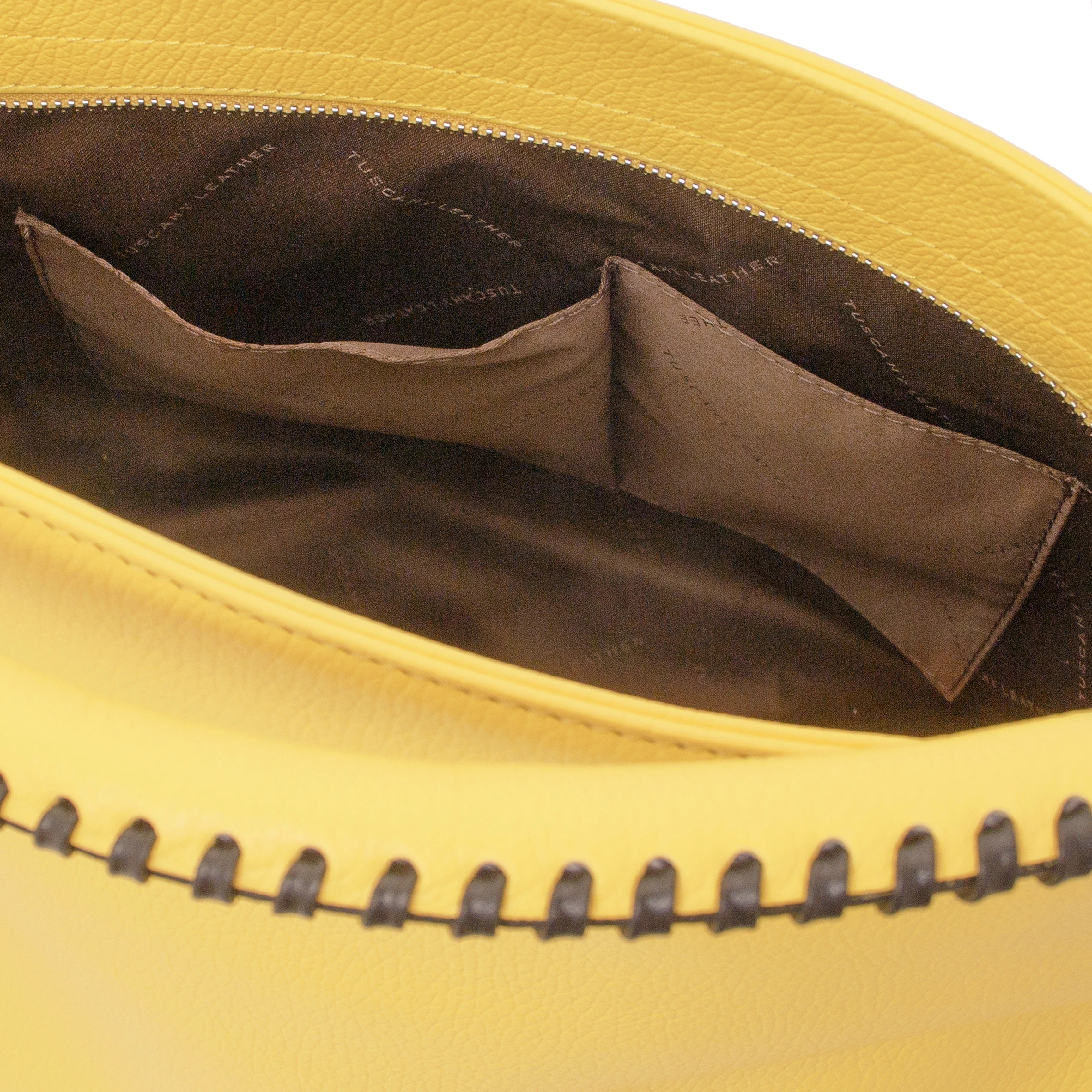 Interior view of the TL Bag Soft Leather Handbag in Yellow showing two opened pockets on white background - L'Atelier Global