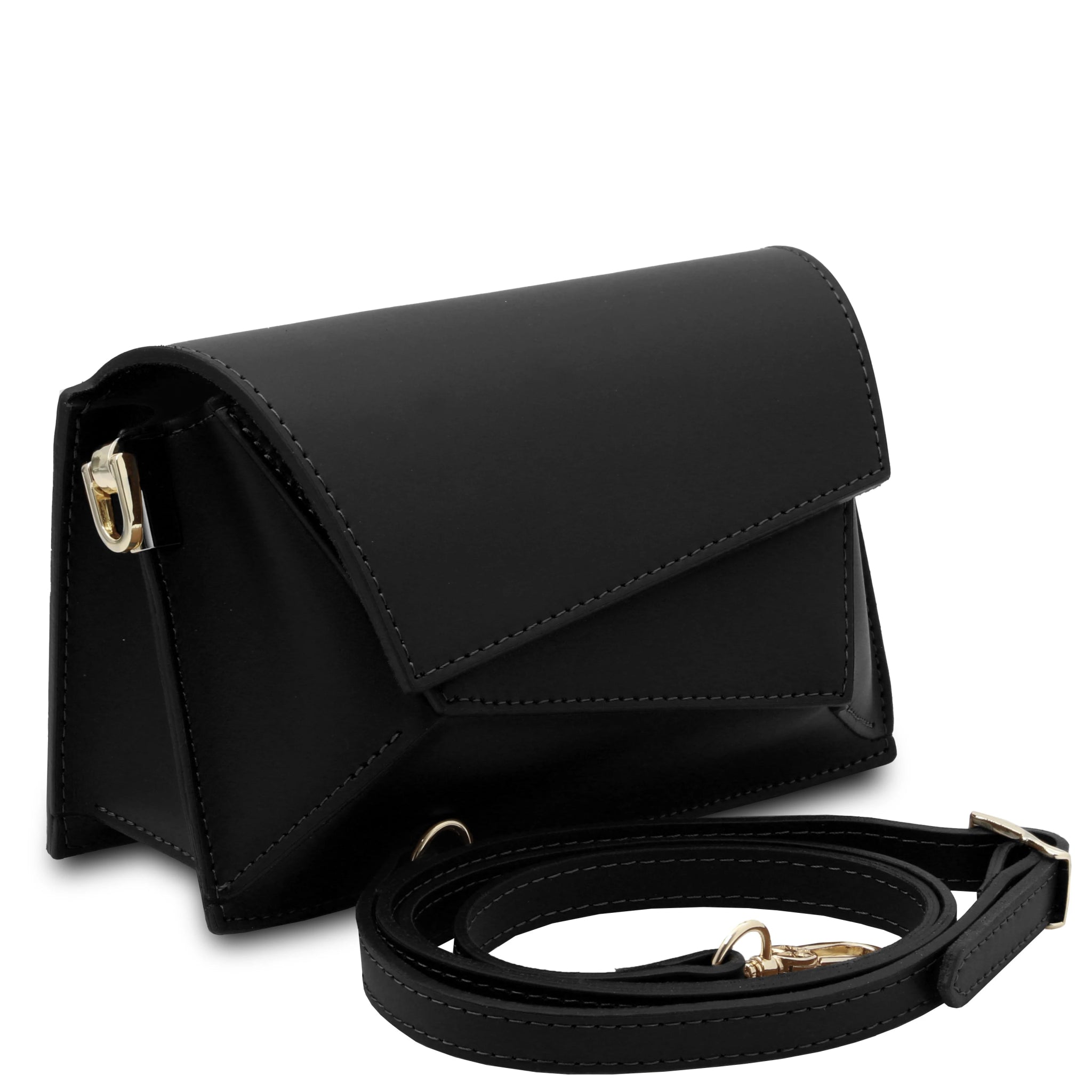 Front angled view TL Leather Assymetrical Shoulder Bag  in Black showing bag sa a clutch sitting near its deatchable shoulder strap 