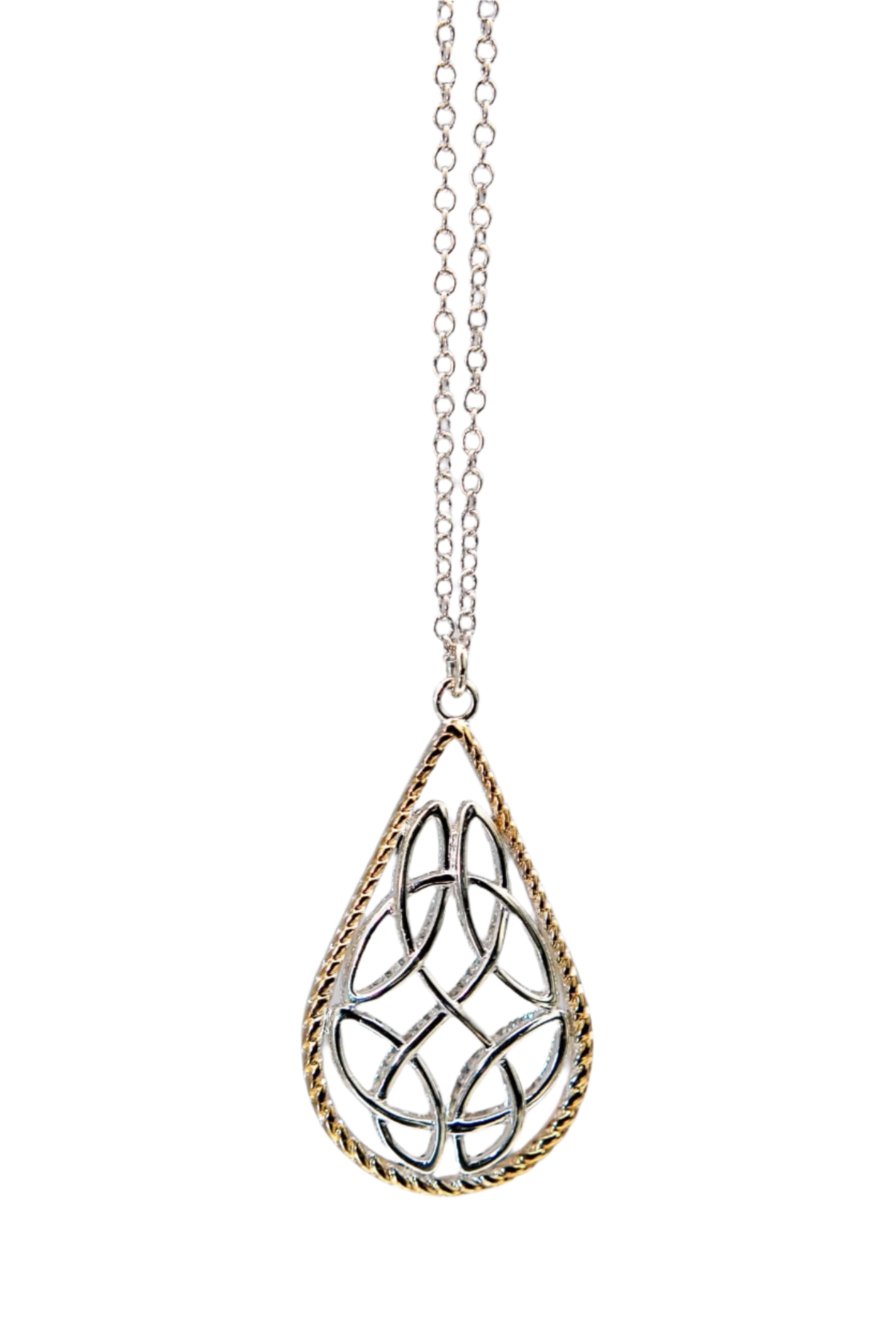 Trinity Reversible Pendant Necklace hanging in front of a gray  background- L'Atelier Global