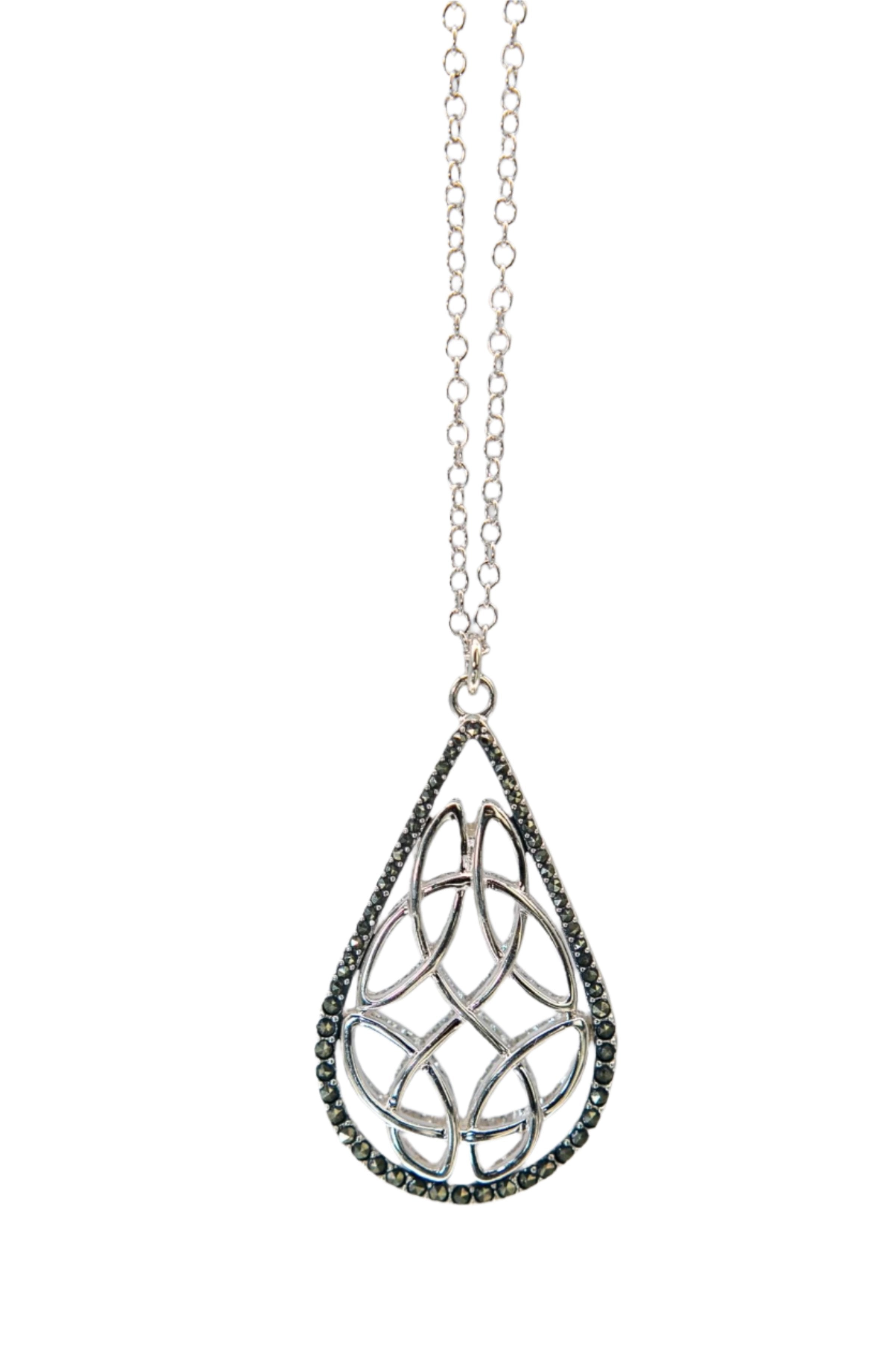 Trinity Reversible Pendant Necklace marcasite side hanging in front of a gray  background- L'Atelier Global